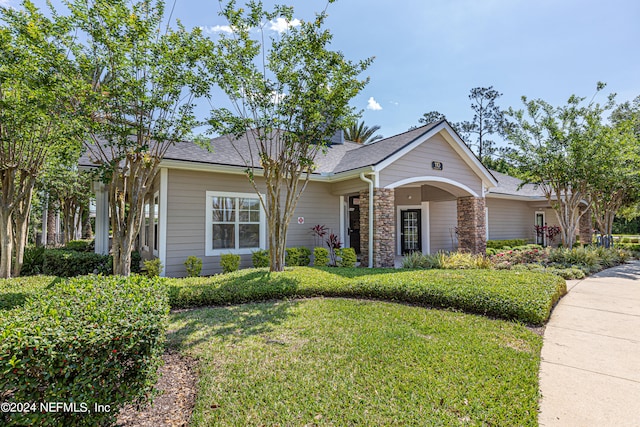 single story home with a front yard