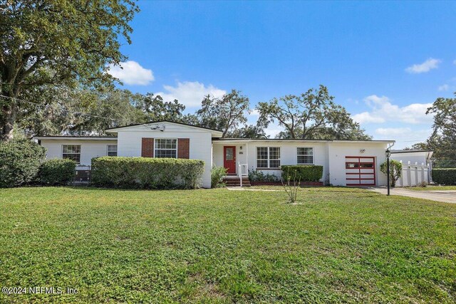 929 Bordeau Ave W, Jacksonville, FL 32211 - ranch-style house featuring a garage, a front yard, and driveway