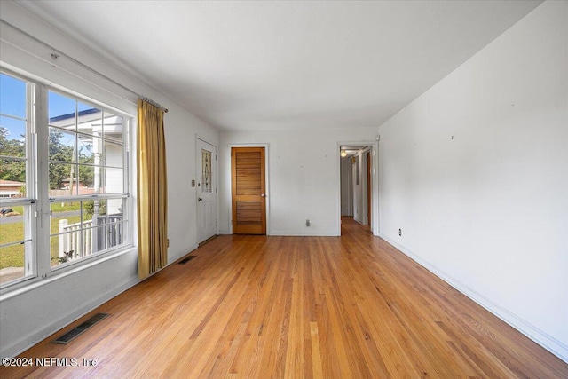 spare room with light hardwood / wood-style floors