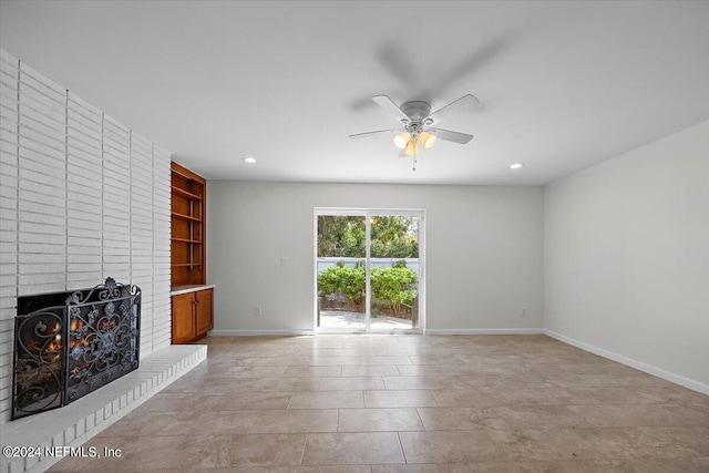 unfurnished living room with light tile patterned flooring, a fireplace, and ceiling fan