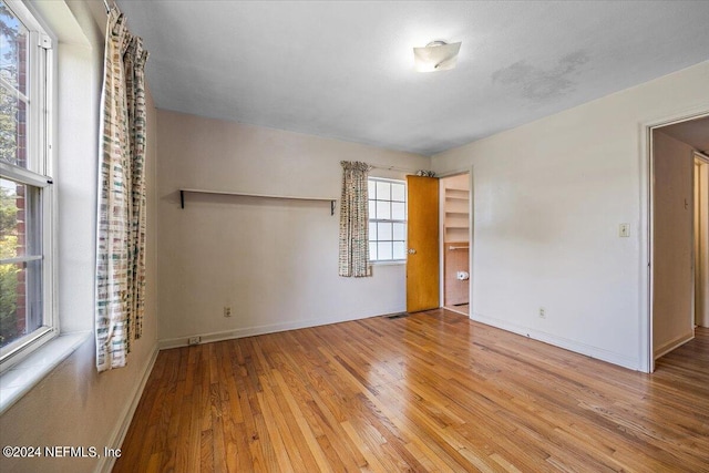 spare room with light hardwood / wood-style flooring