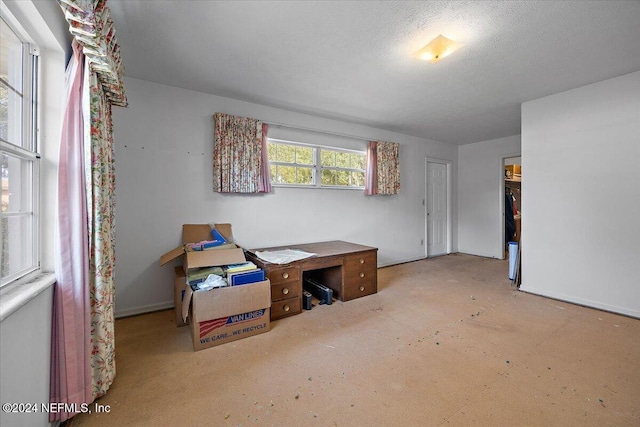 miscellaneous room featuring a textured ceiling