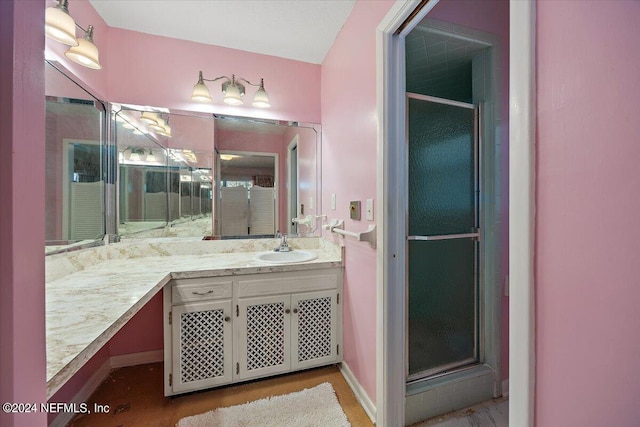 bathroom with vanity and walk in shower