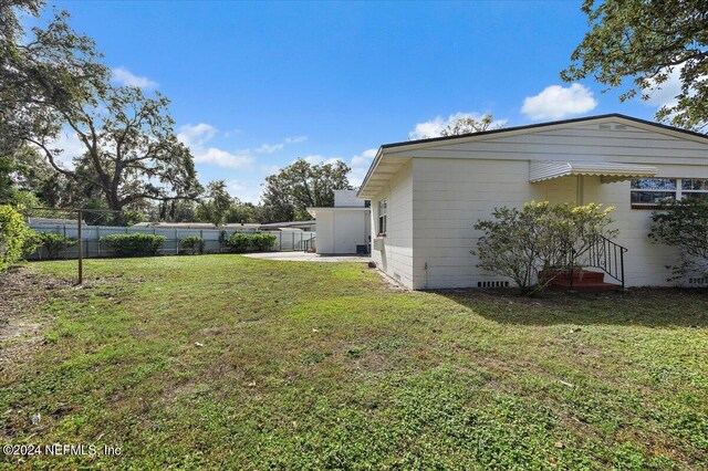 929 Bordeau Ave W, Jacksonville, FL 32211 - view of yard with fence and a patio area