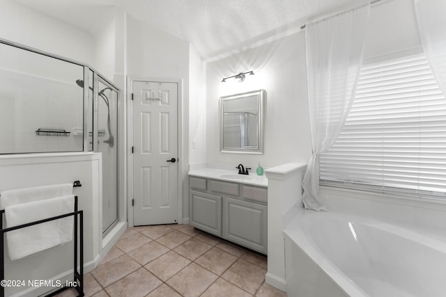 bathroom featuring vanity, tile patterned floors, and independent shower and bath