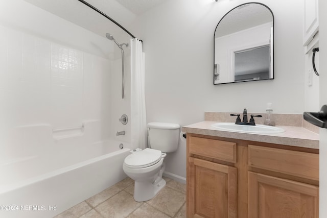 full bathroom with vanity, tile patterned flooring, washtub / shower combination, and toilet