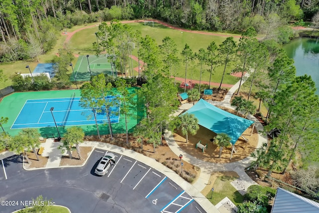 birds eye view of property with a water view