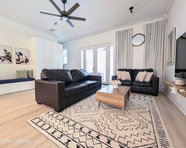 living room with light hardwood / wood-style floors, ceiling fan, and french doors