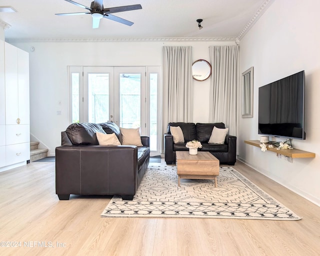 living room featuring french doors, light wood-type flooring, and ceiling fan