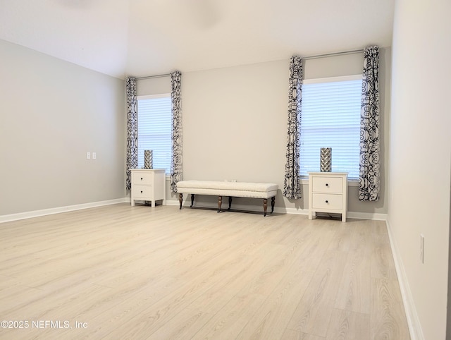 unfurnished bedroom with light hardwood / wood-style flooring and vaulted ceiling