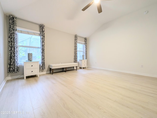 unfurnished bedroom featuring ceiling fan, light hardwood / wood-style flooring, and vaulted ceiling