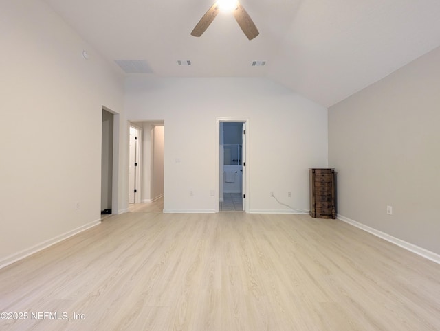 unfurnished bedroom with lofted ceiling, ensuite bathroom, ceiling fan, and light hardwood / wood-style floors