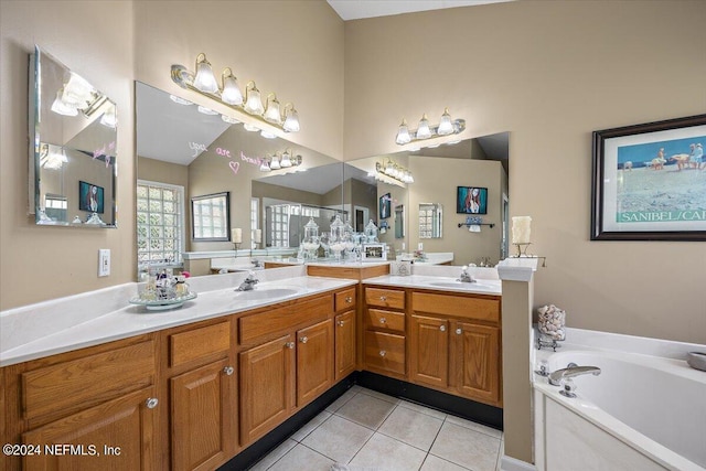 bathroom with vanity, a bathtub, and tile patterned flooring