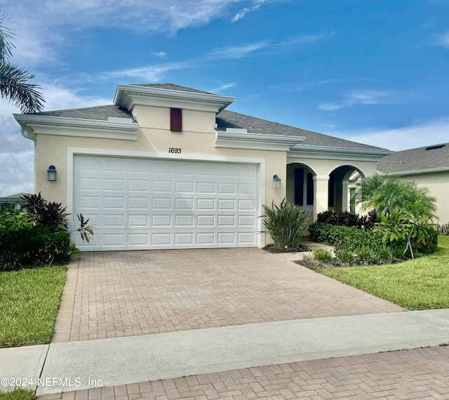 view of front of home with a garage