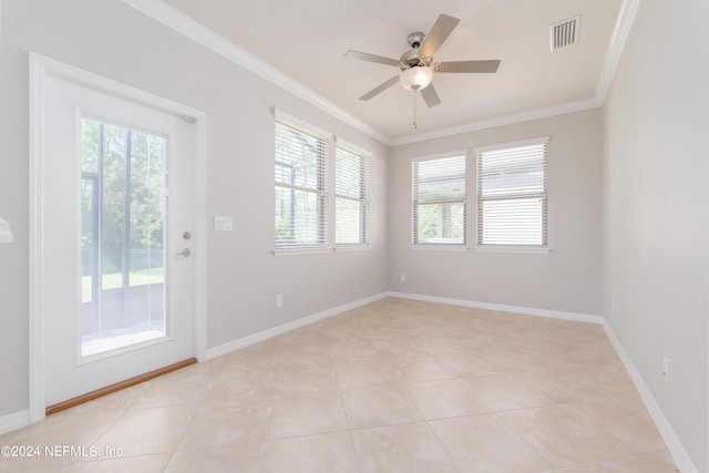 tiled empty room with ceiling fan and crown molding