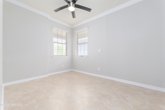 spare room featuring ceiling fan, light tile patterned flooring, and ornamental molding