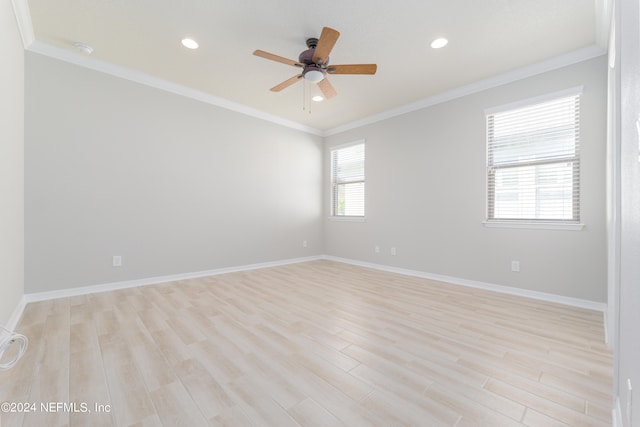 spare room with ceiling fan, crown molding, and light hardwood / wood-style floors