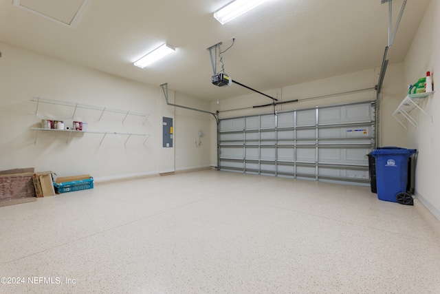 garage featuring a garage door opener and electric panel