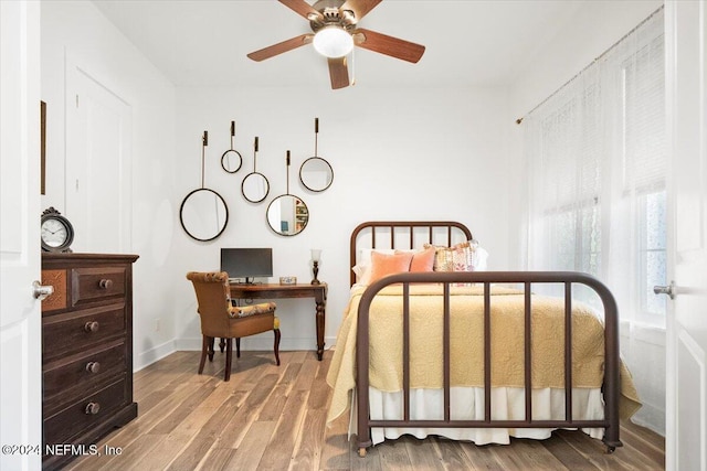 bedroom featuring wood-type flooring and ceiling fan