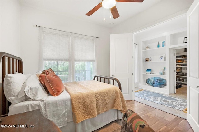 bedroom featuring hardwood / wood-style flooring and ceiling fan