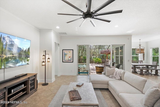 living room with a textured ceiling and plenty of natural light