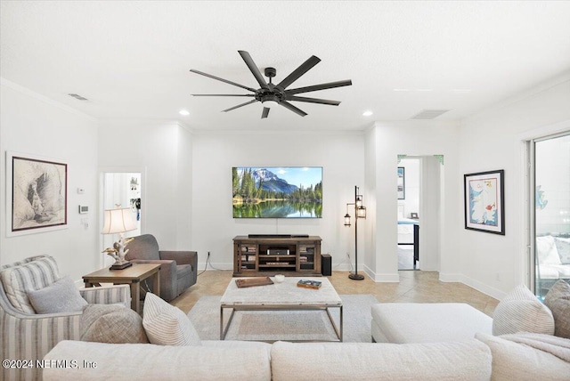 tiled living room with a wealth of natural light, ornamental molding, and ceiling fan