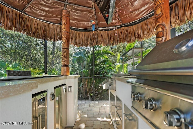 view of patio / terrace featuring area for grilling and beverage cooler