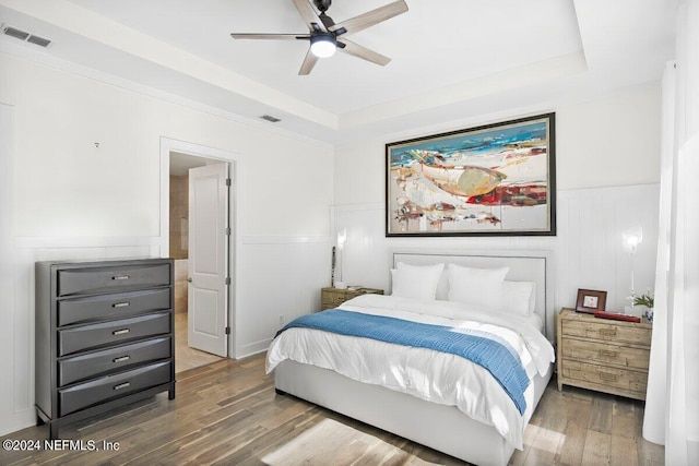 bedroom with dark wood-type flooring and ceiling fan