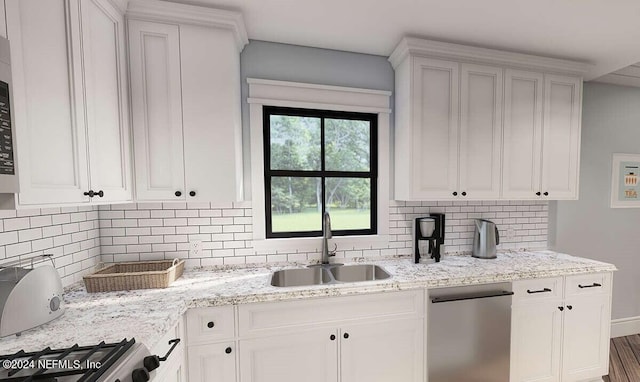 kitchen with wood-type flooring, sink, white cabinets, stainless steel appliances, and backsplash