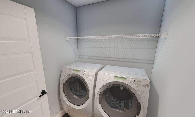 laundry area with washing machine and dryer