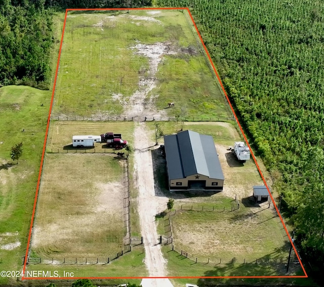 birds eye view of property with a rural view