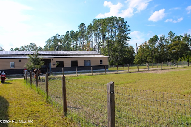 view of yard with a rural view