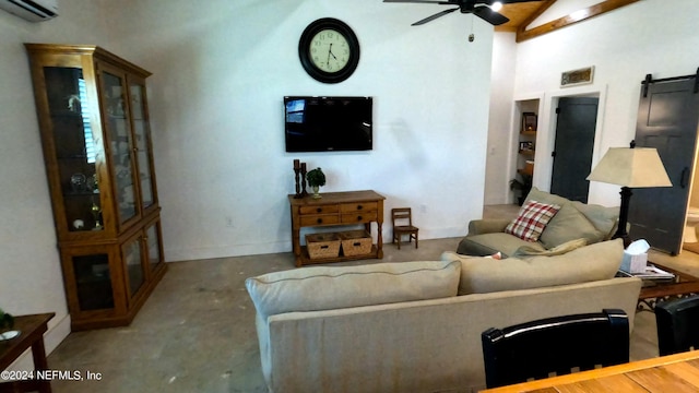 living room with ceiling fan, lofted ceiling, concrete flooring, and a wall mounted AC