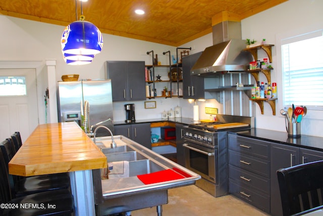 kitchen with pendant lighting, island exhaust hood, appliances with stainless steel finishes, wooden ceiling, and a breakfast bar area