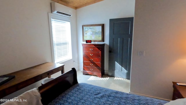 carpeted bedroom with a wall unit AC