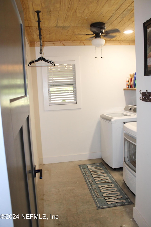 laundry area featuring wood ceiling, ceiling fan, and washer and clothes dryer