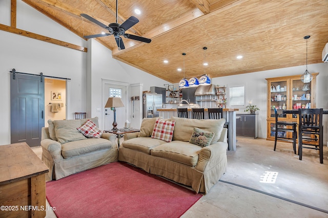 17667 Andrews Rd, Hilliard, FL 32046 - living area featuring a ceiling fan, high vaulted ceiling, wood ceiling, concrete flooring, and a barn door