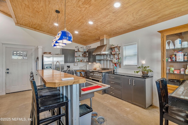 17667 Andrews Rd, Hilliard, FL 32046 - kitchen featuring open shelves, wood counters, stainless steel appliances, concrete floors, and wall chimney exhaust hood