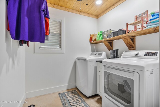 17667 Andrews Rd, Hilliard, FL 32046 - clothes washing area with baseboards, wood ceiling, washing machine and dryer, and laundry area