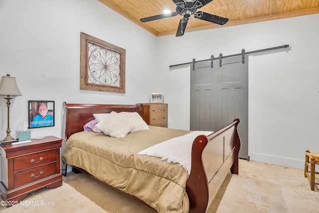 17667 Andrews Rd, Hilliard, FL 32046 - bedroom with baseboards, ceiling fan, wood ceiling, a closet, and a barn door