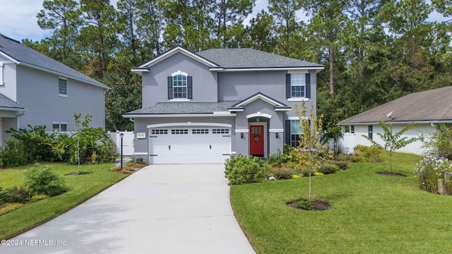 view of front facade with a garage and a front yard