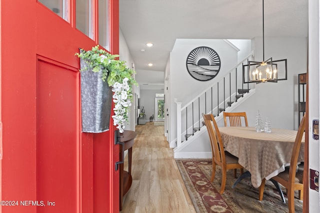 foyer featuring an inviting chandelier and hardwood / wood-style floors