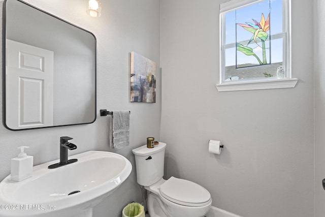 bathroom with toilet and sink