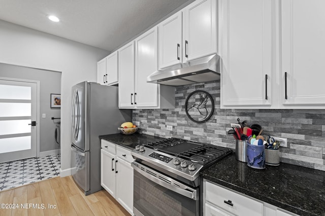 kitchen featuring appliances with stainless steel finishes and white cabinets