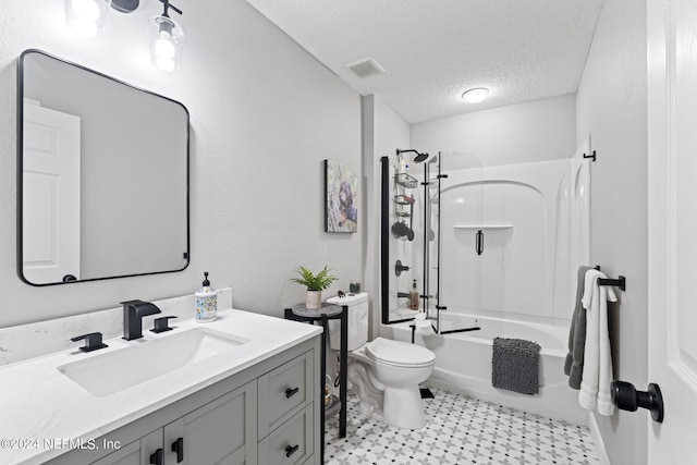 full bathroom featuring vanity, toilet, a textured ceiling, and washtub / shower combination