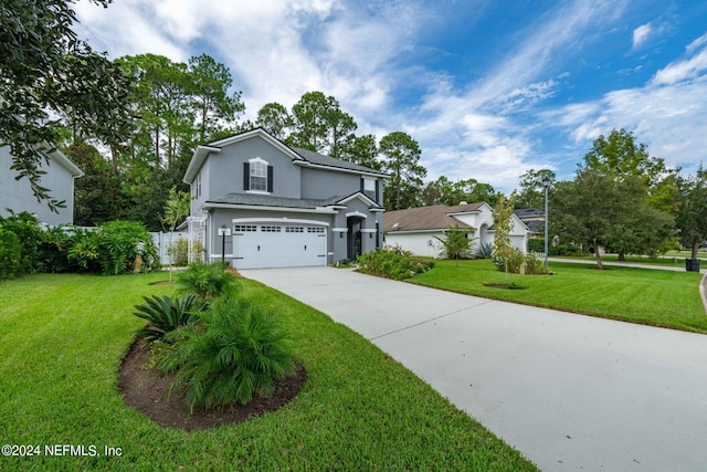 front facade featuring a garage and a front yard