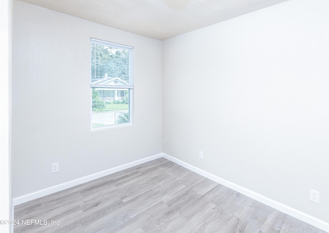 unfurnished room featuring light wood-type flooring