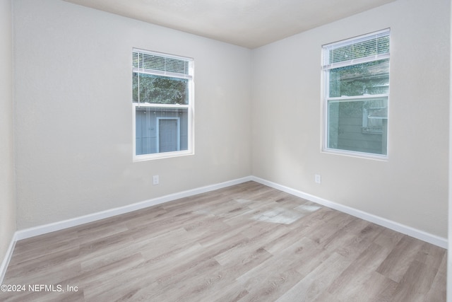 spare room with light hardwood / wood-style floors