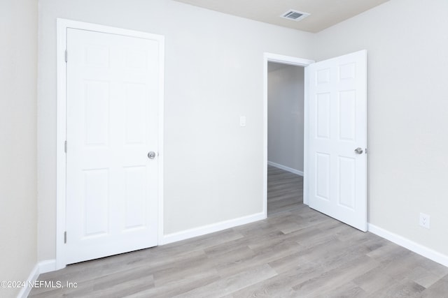 unfurnished bedroom featuring light wood-type flooring