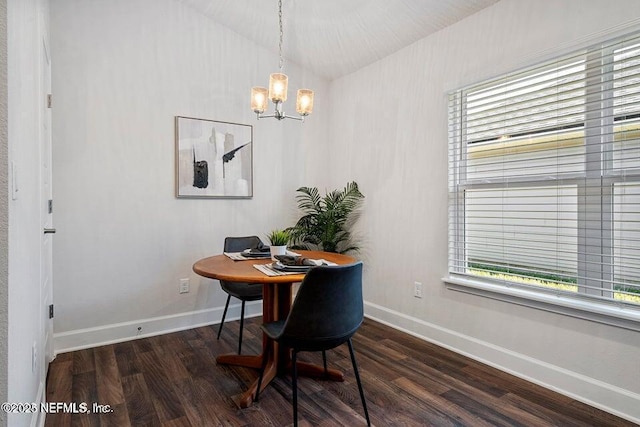 dining space featuring lofted ceiling, a healthy amount of sunlight, and dark hardwood / wood-style flooring